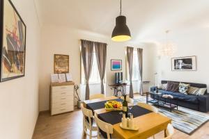a living room with a table and a couch at Apartment Miško in Dubrovnik