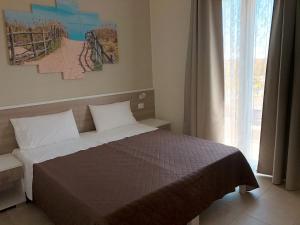 Ένα ή περισσότερα κρεβάτια σε δωμάτιο στο Casa Vacanze La Conca