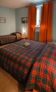 a hotel room with a bed and a window at Hotel mediterraneo in Giovinazzo