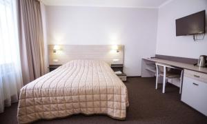 Un pat sau paturi într-o cameră la Готель Гірська Тиса