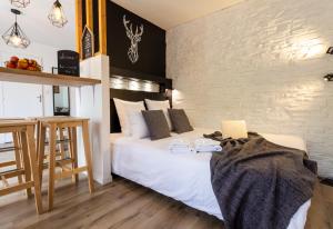 Llit o llits en una habitació de Studio ToulouseCityStay Blagnac