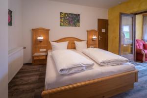 Ein Bett oder Betten in einem Zimmer der Unterkunft Pension Villa Lockstein
