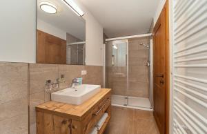 a bathroom with a sink and a shower at Haus Gertrud in Sankt Anton am Arlberg