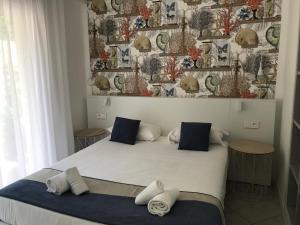 a bedroom with a bed with two pillows on it at Prea Gianca in Bonifacio