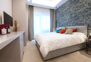 Łóżko lub łóżka w pokoju w obiekcie Napoli City Center - Appartamenti e Camere
