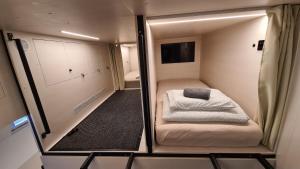 Postel nebo postele na pokoji v ubytování Cabin HOSTEL