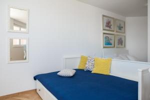 Postel nebo postele na pokoji v ubytování Blue Lagoon Beach Apartments