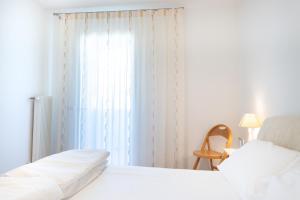 Säng eller sängar i ett rum på Appartamento Borgo Peschiere