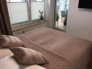 Posteľ alebo postele v izbe v ubytovaní Apartament S&S Nadmorskie Tarasy Kołobrzeg D302