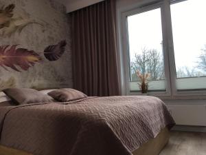 Posteľ alebo postele v izbe v ubytovaní Apartament S&S Nadmorskie Tarasy Kołobrzeg D302