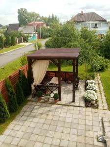 a table with a blanket on top of it at Эврика! Апартаменты с сауной в частном доме in Velikiy Novgorod