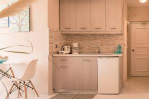 Kuchyň nebo kuchyňský kout v ubytování Remvi Deluxe Apartment 104 with Sea View