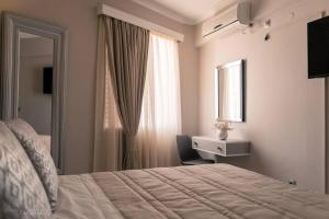 Postel nebo postele na pokoji v ubytování Remvi Deluxe Apartment 104 with Sea View