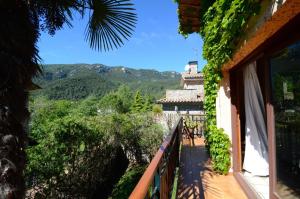 a balcony of a house with a view of the mountains at CASA TERESA in Albanya