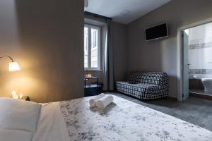 A bed or beds in a room at City Break Nomentana