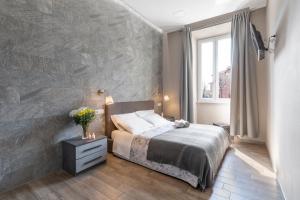 A bed or beds in a room at City Break Nomentana