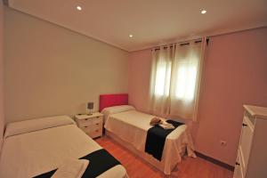 Posteľ alebo postele v izbe v ubytovaní Avenida Paseo 3 Rooms 2 baños