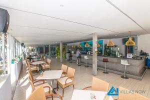 A restaurant or other place to eat at Las Brisas 112 - LH1033 By Villas Now Ltd