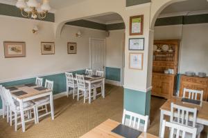 a dining room with a table and chairs at Toothbrush Rooms at Lattice Lodge - Self Catering in Ipswich