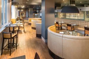 a large kitchen with a large island in the middle at Crowne Plaza Chester, an IHG Hotel in Chester