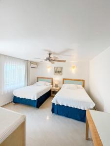 Ένα ή περισσότερα κρεβάτια σε δωμάτιο στο Hotel Cocoplum Beach