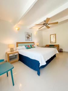Ένα ή περισσότερα κρεβάτια σε δωμάτιο στο Hotel Cocoplum Beach