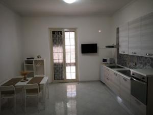 A kitchen or kitchenette at Romano Appartamenti