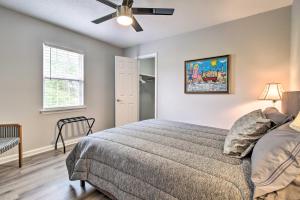 a bedroom with a bed and a ceiling fan at Ideally Located Luxe Beach House on Tybee Island in Tybee Island