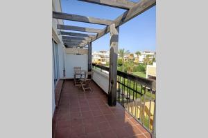 a balcony with a view of the ocean at A TU VERA Apartamento en Vera Playa in Playas de Vera