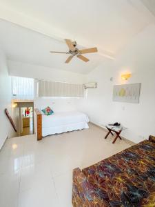 Ένα ή περισσότερα κρεβάτια σε δωμάτιο στο Hotel Cocoplum Beach
