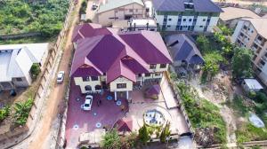 an overhead view of a house with purple roofs at Gya-son Royal Guest House in Kumasi