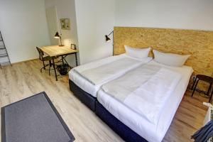 เตียงในห้องที่ fewo1846 - Wechselstube - komfortable Unterkunft mit 2 Schlafzimmern und Terrasse