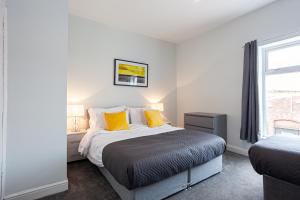 Postel nebo postele na pokoji v ubytování Hacken Lodge