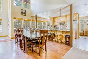 a kitchen and dining room with a table and chairs at Evergreen House in Government Camp