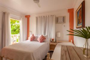 Cama ou camas em um quarto em Pousada Casablanca