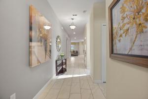 a hallway with paintings on the walls and a hallway with a hallwayngth at Havilah Vacation Villas Resort Club in Davenport