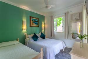 Cama ou camas em um quarto em Pousada Casablanca