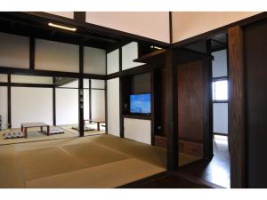 a room with glass doors and a tv in it at Orizon - Vacation STAY 21711v in Minamiboso