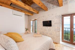 Un pat sau paturi într-o cameră la Villa Kontesa