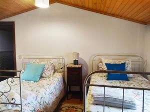 Postel nebo postele na pokoji v ubytování Casa do Canastro