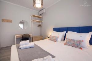 Krevet ili kreveti u jedinici u objektu PORTO PORTES suites