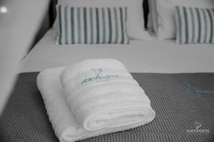 Krevet ili kreveti u jedinici u objektu PORTO PORTES suites