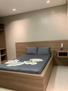 Tempat tidur dalam kamar di Motel Passione