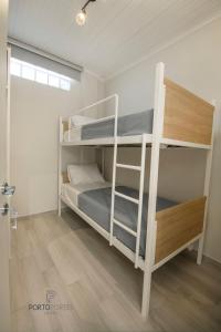 Krevet ili kreveti u jedinici u objektu PORTO PORTES suites