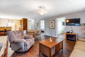 a living room with a couch and chairs and a table at Winston Way in Pigeon Forge