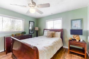 a bedroom with a bed and a ceiling fan at Winston Way in Pigeon Forge