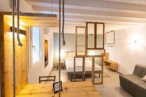 a room with a bed and a room with a swing at Casa San Cristoforo in Chioggia