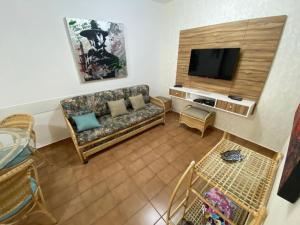 TV a/nebo společenská místnost v ubytování Guarujá Flat