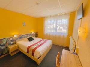TV a/nebo společenská místnost v ubytování Hotel Le Ronchamp