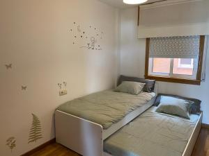 Posteľ alebo postele v izbe v ubytovaní Luky Miño